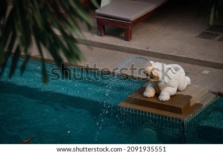 A pool decorated with a Thai hotel's elephant fountain. Photo stock © 