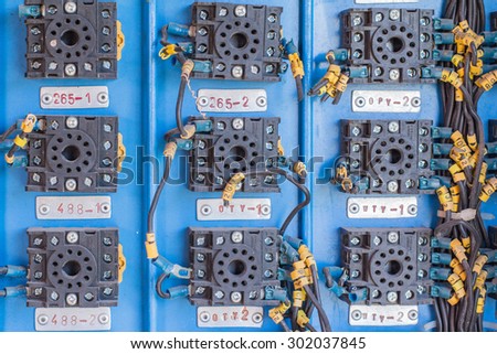 A row of switched electrical circuit breakers