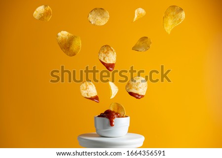 Similar – Image, Stock Photo Potato chips and sauce on the table, close up