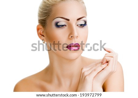Beautiful face of a woman with clean skin. looking down. - white background