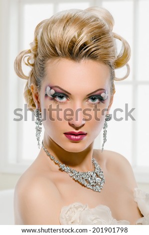 Fashion Beauty Model. Bride. Creative Make up and Hair Style. On window background