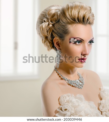Fashion Beauty. Bride. Perfect Creative Make up and Hair Style. On window background