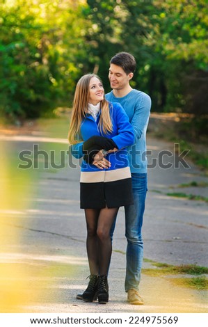 happy autumn couple in love portrait. outdoor. full length