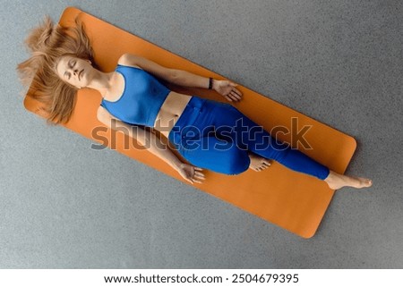 Similar – Image, Stock Photo Sportswoman lying on sports ground near basketball