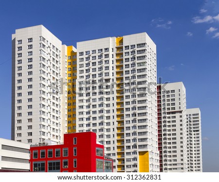 Multistory new modern apartment building. Stylish living block of flats