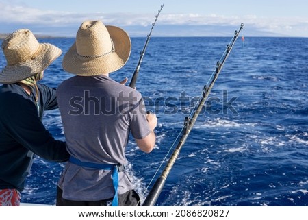 Similar – Image, Stock Photo two fishermen in a boat with reflection in a still river water at twilight on autumn landscape.