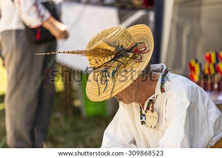 Suceava, Romania - August the 2nd 2015 - Elder dressed in traditional clothes at the \