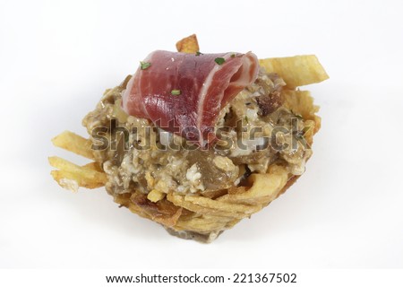 Basket of mushrooms scrambled with ham and chips on white background