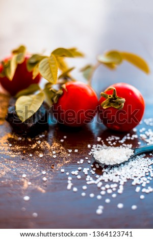 Face pack of hing or Asafoetida on wooden surface i.e. Hing powder well mixed with tomato pulp and sugar.For the treatment of skin whitening,.All the ingredients present on the surface. Photo stock © 