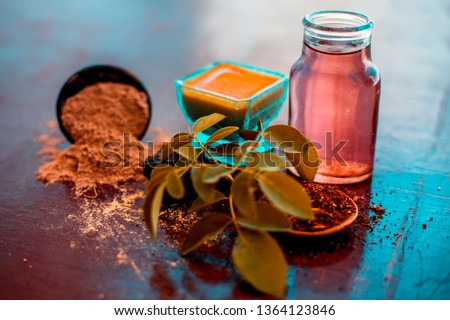 Face pack of devil's dung powder on wooden surface i.e. Hing powder well mixed with sandal wood powder or chandan and rose water.Used for the treatment for instant glow. Photo stock © 