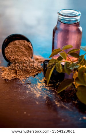 Face pack of devil's dung powder on wooden surface i.e. Hing powder well mixed with sandal wood powder or chandan and rose water.Used for the treatment for instant glow. Photo stock © 
