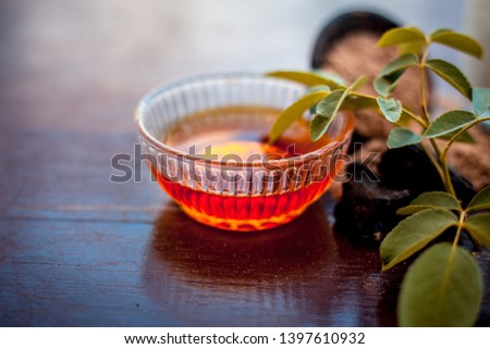 Face pack for anti-dryness on wooden surface i.e. Hing powder well mixed with honey and milk in a bowl and entire raw ingredients present on the surface. Photo stock © 