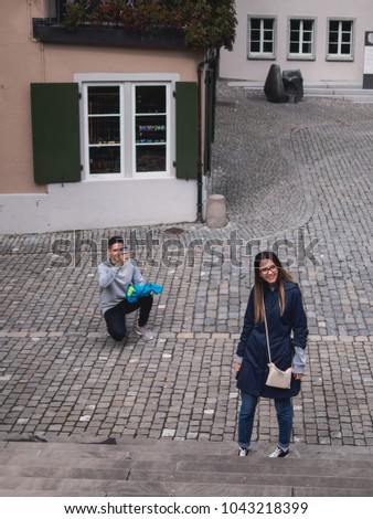 Similar – Image, Stock Photo Man shooting building facade with smartphone in downtown