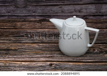 White tea pot ceramic wooden table, Vintage tone. Top view. Stock foto © 
