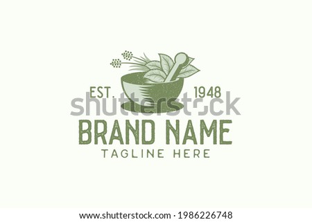 Vintage herbal logo vector graphic with mortar, pestle, and herbal. Foto stock © 