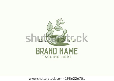 Vintage herbal logo vector graphic with mortar, pestle, and herbal. ストックフォト © 