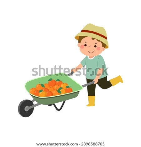 Little boy gardener pushing wheelbarrow full of oranges