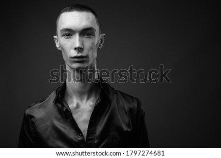 Similar – Image, Stock Photo Eccentric androgynous man in black outfit