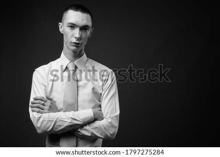 Similar – Image, Stock Photo Eccentric androgynous man in black outfit