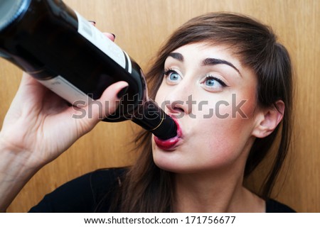 Young woman drinking wine