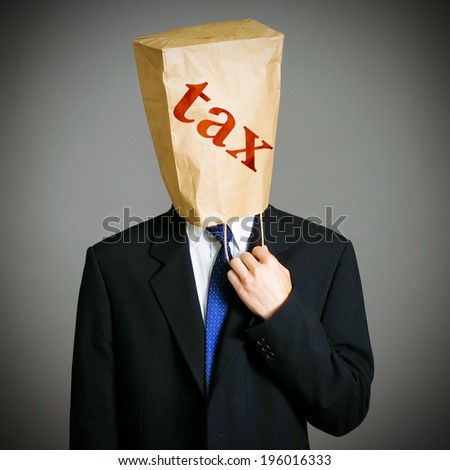 Businessman with a paper bag on head with tax note