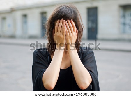 Young nice woman with hidden face