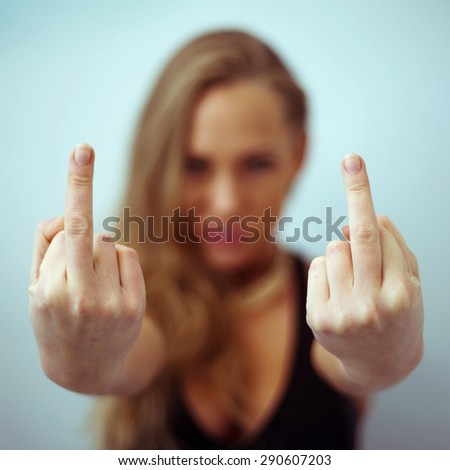 Young sexy girl showing middle finger gesture.