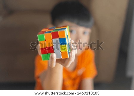 Similar – Image, Stock Photo Kid grabs his toy Child