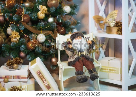 New Year festive mood with Santa toy and present boxes