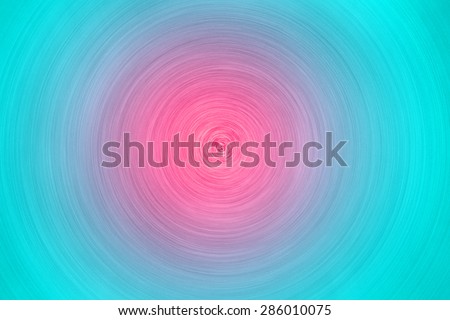 Radial metallic pink and green circle texture, background
