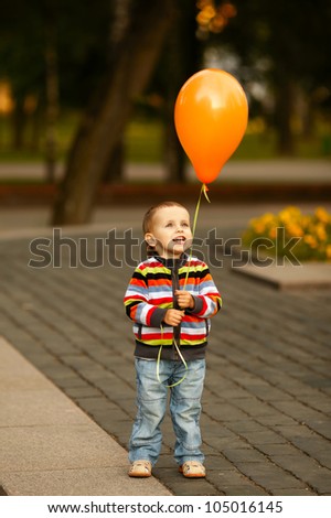little funny boy with balloon