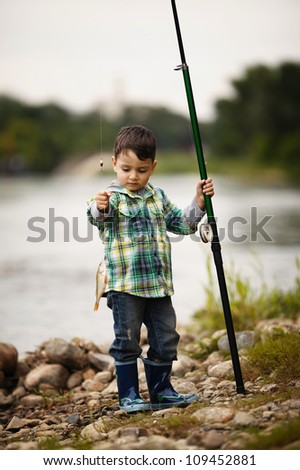 Similar – Image, Stock Photo child holding a fish and showing it to the camera