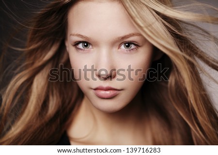 beautiful teen girl portrait with windy hair