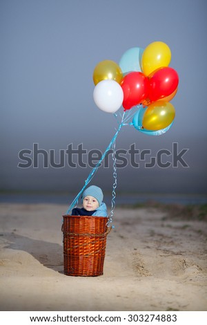 little boy wants to fly on balloons away