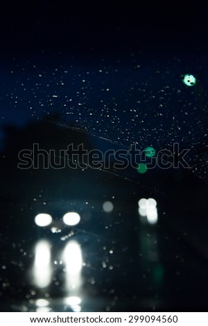 Driving car during raining . Night shot