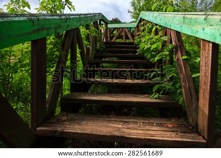 Old wooden ladder leading to the house