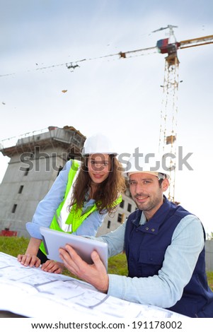 View of Co-workers working on a construction site