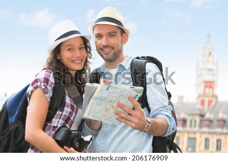 View of a Young couple of tourists visiting city
