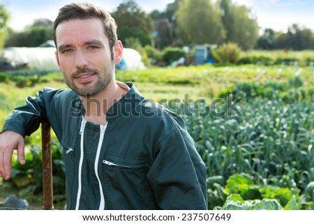 Portrait of a Young attratcive farmer in front of garden