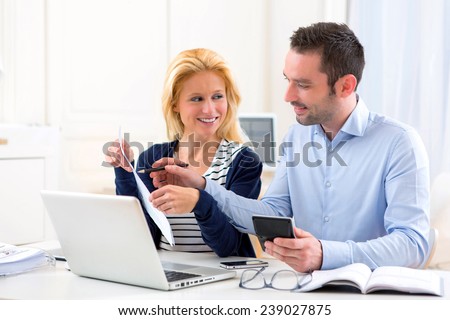 View of an Attractive couple doing administrative paperwork