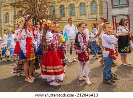 KIEV, UKRAINE - AUGUST 24: Ukraine Independence Day. Kontraktova area in Podil twin children in national traditional costume of their regions, Ukraine on August 24, 2014.