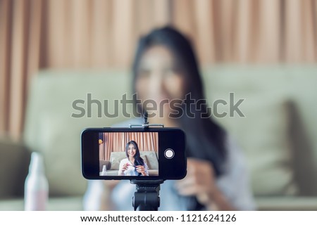Similar – Image, Stock Photo Fashion blogger recording video at home