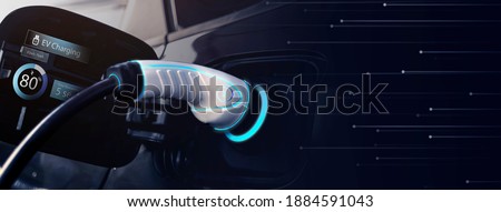 Power cable pump plug in charging power to electric vehicle EV car with modern technology UI control information display, car fueling station connected power cable alternative sustainable eco energy Stock foto © 