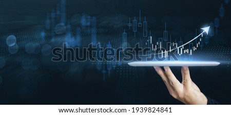 Businessman forex trader using tablet technology indicating rising trend growth in the market, analyzing financial data buying stock exchange currency, crypto forex stock market blue banner background