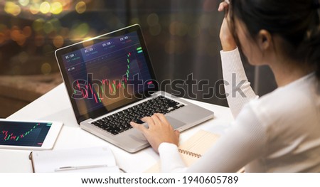 Businesswoman trader work from home using laptop tablet technology data analysis growth trend on graph forex foreign stock market exchange trading crypto currency, modern home living room office  Foto stock © 