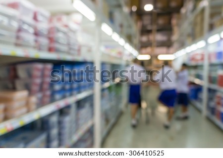 Blurred abstract background of people shopping in super market  : Shoppers in grocery store in a gangway : Walkway with full with goods and products on shelves in super market