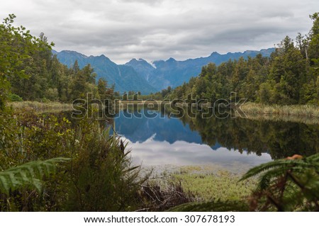 Beautiful reflections of Southern Alps at Lake Matheson, South Island, New Zealand