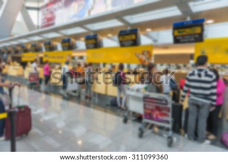 Abstract Blur Background : Airport Check-In Counters With Passengers And Crowd Control Barriers With Bokeh,The public check-in area
