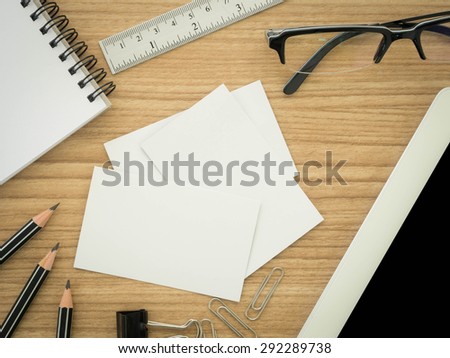 blank business cards with stationary ,laptop computer  on the desk. view top
