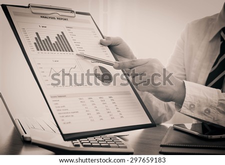Businessmen are analyzing market data to clients or partners have been informed.